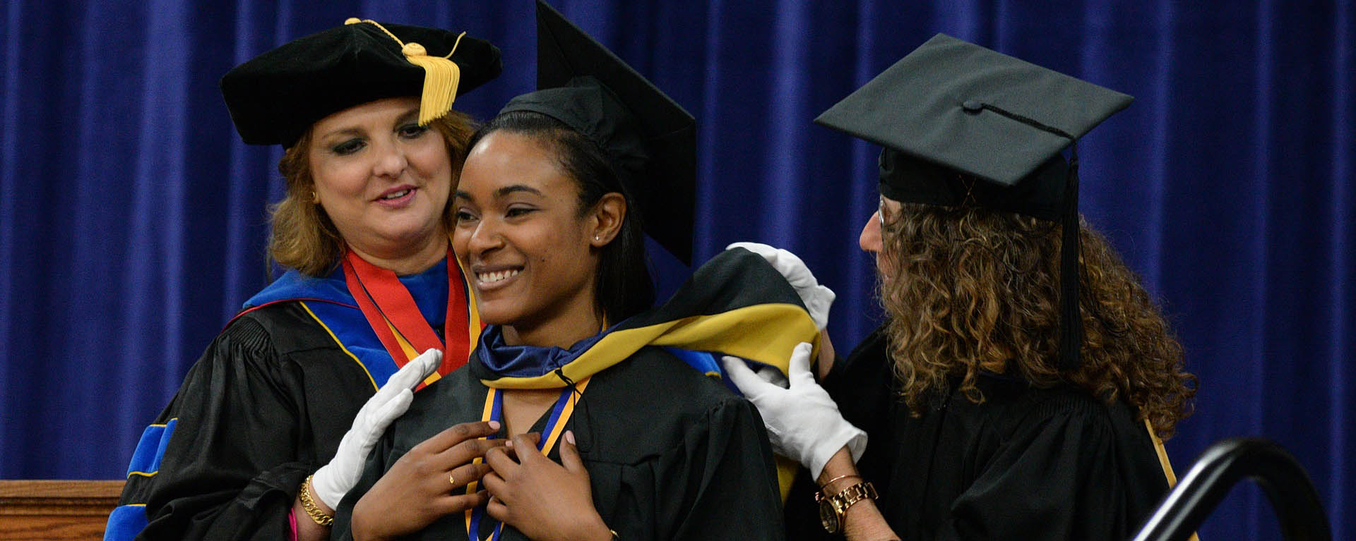 Student on stage at graduation